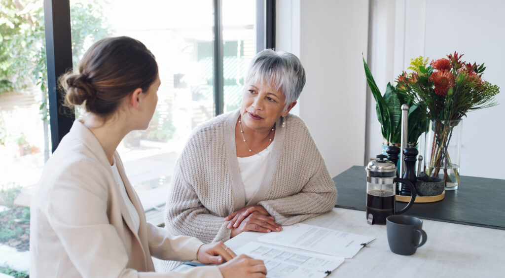 Older woman discussing care planning with a care coordinator